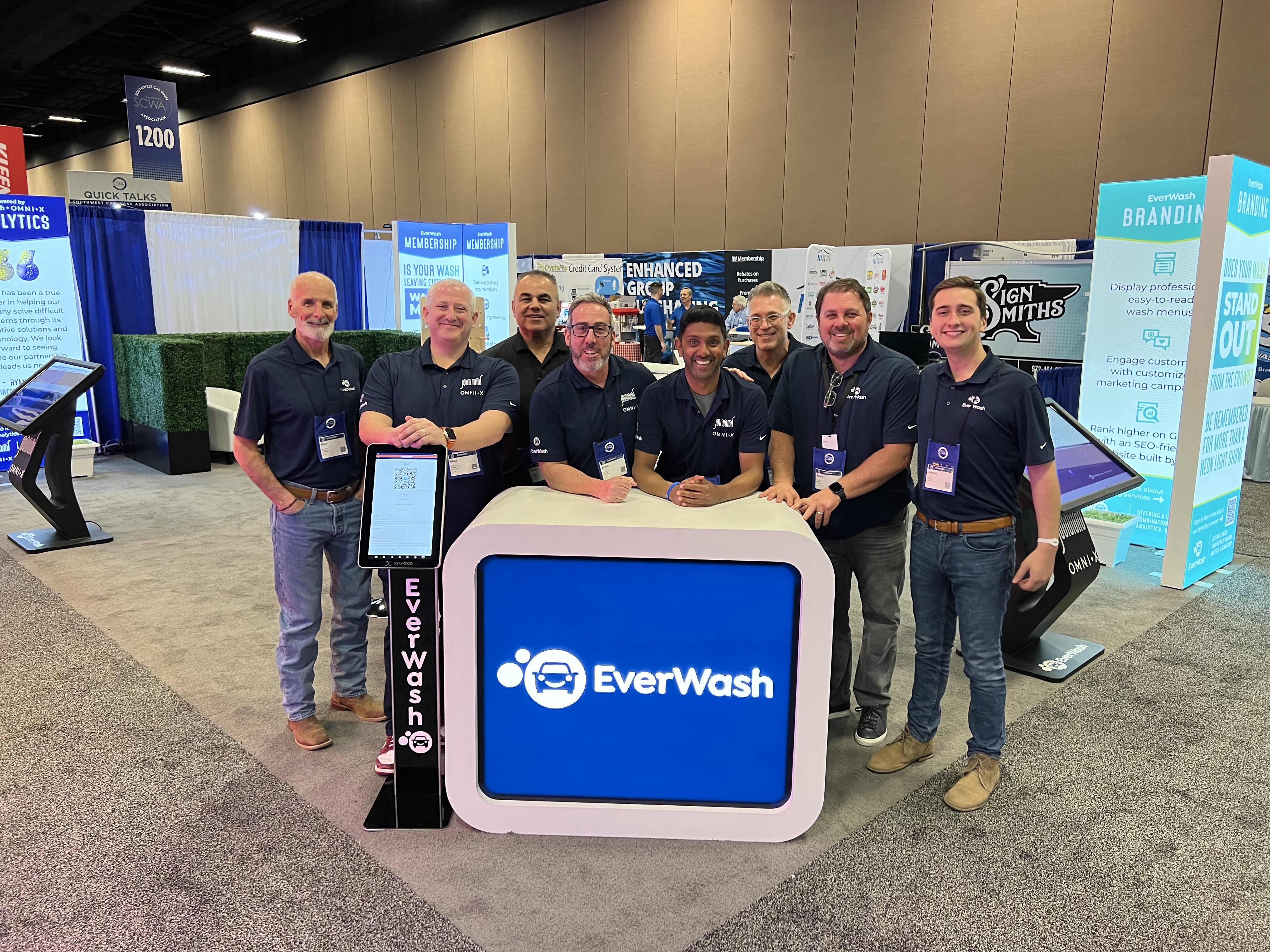 EverWash and omniX booth attendees